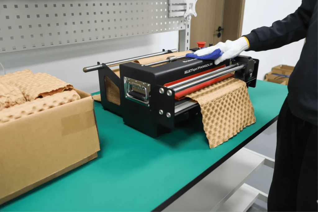 Paper bubble machine in a warehouse packing area for protective packaging operations
