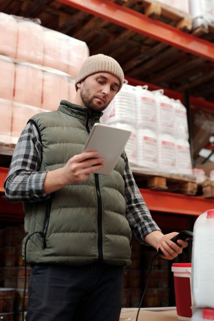Warehouse worker reviewing digital packing instructions on a tablet