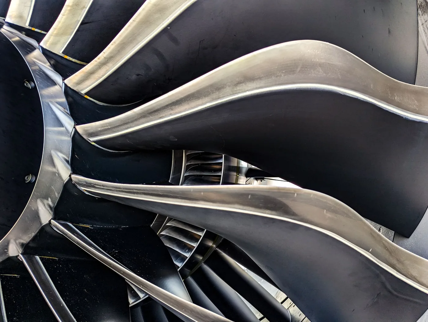 Close view of curved metal turbine blades