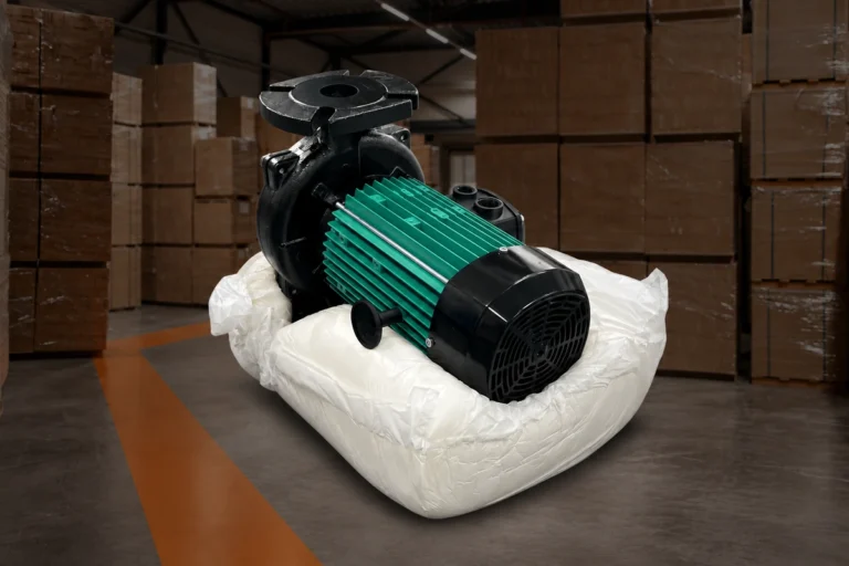 Pump resting in a formed foam cushion displayed against a warehouse background.